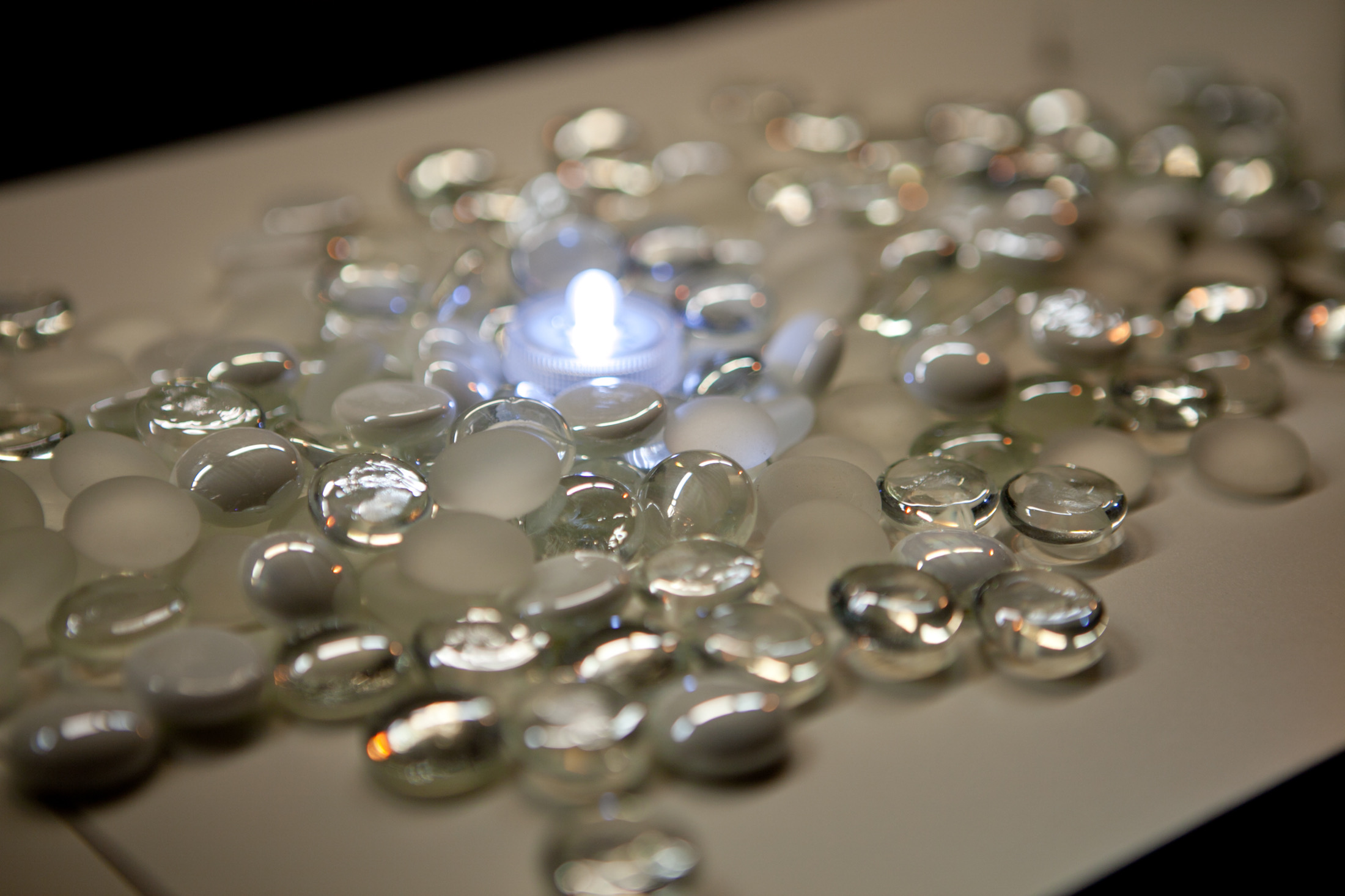 Centerpiece component — clear and white glass beads with submersible LED on white lacquered platform base