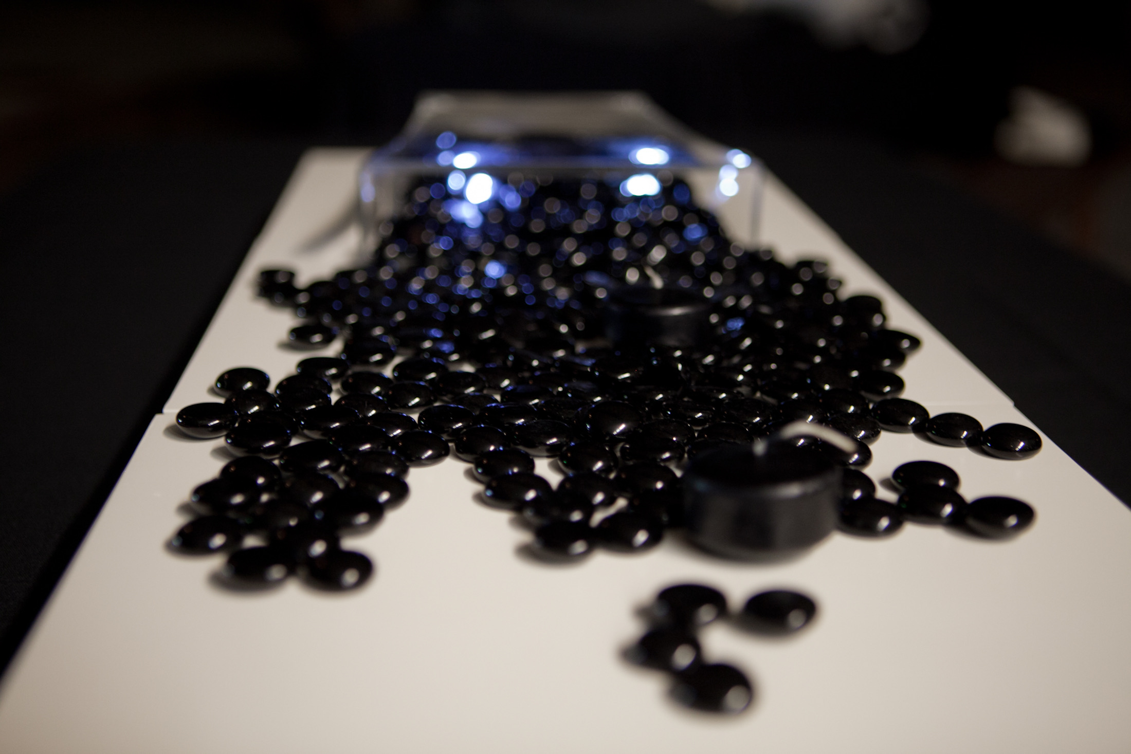 Centerpiece component — black glass beads with submersible LED light on white platform