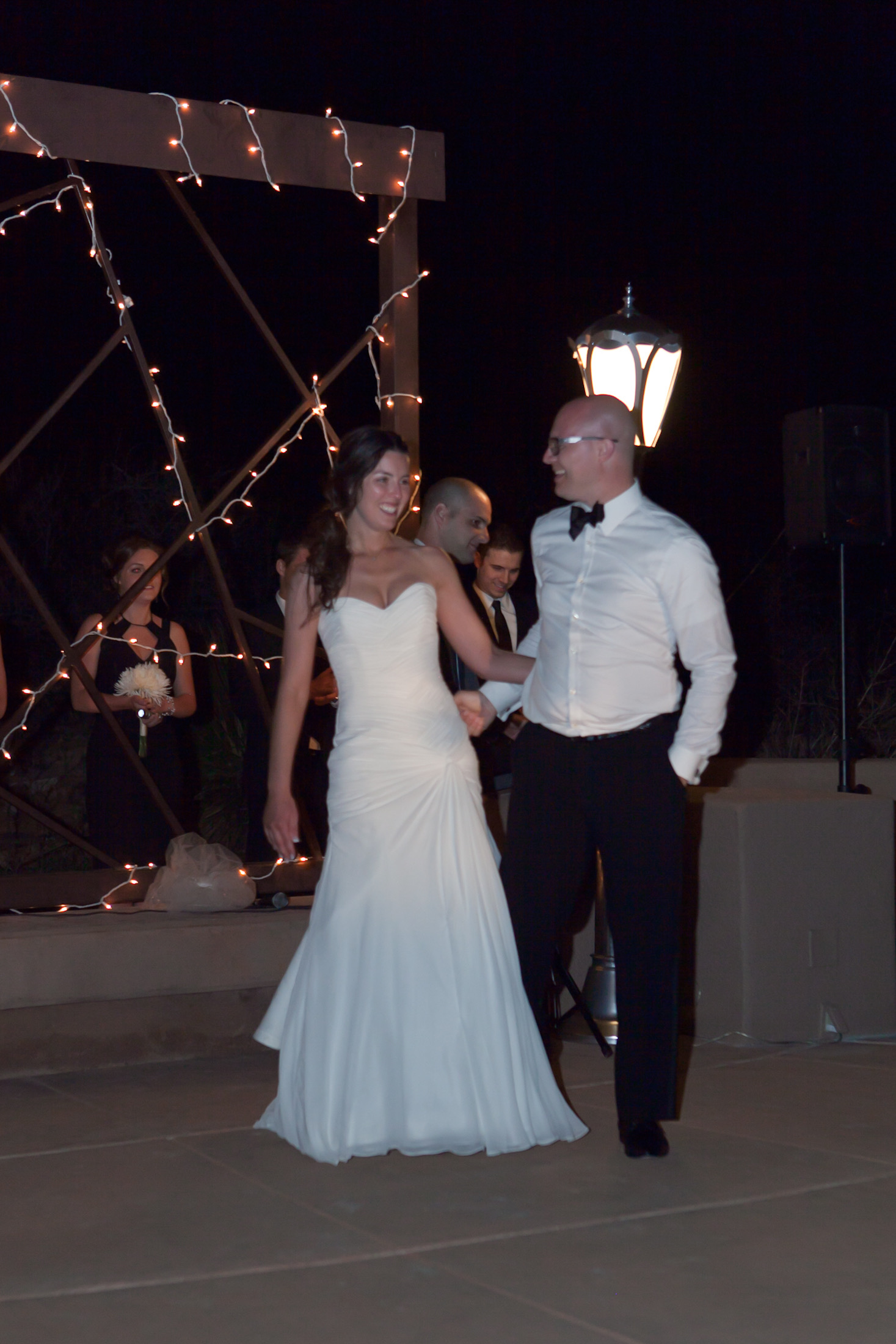 First dance — couple face to face, showing groom in Armani tuxedo with bow tie